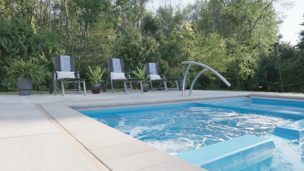 Bubbling spa and deck jet arc on a paver pool deck