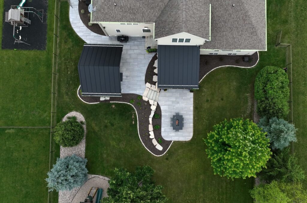 Aerial view of a Neenah home with a paver patio, pavilion and curved walkways